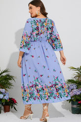 Robe mi-longue fleurie grande taille à col en V et manches trois-quarts